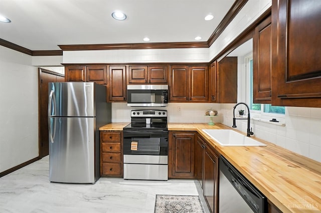 2000 Neeb Rd, Green Twp, OH 45233 - kitchen with appliances with stainless steel finishes, crown molding, wooden counters, light marble finish flooring, and decorative backsplash