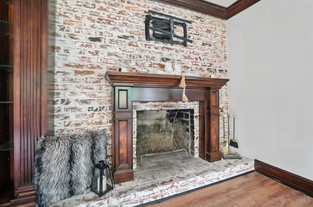 2000 Neeb Rd, Green Twp, OH 45233 - detailed view of crown molding, a brick fireplace, and wood finished floors