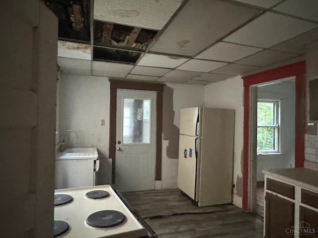 1812 Carroll Ave, Middletown, OH 45042 - kitchen with freestanding refrigerator, range, wood finished floors, and light countertops