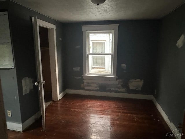 1812 Carroll Ave, Middletown, OH 45042 - spare room featuring wood-type flooring and a textured ceiling