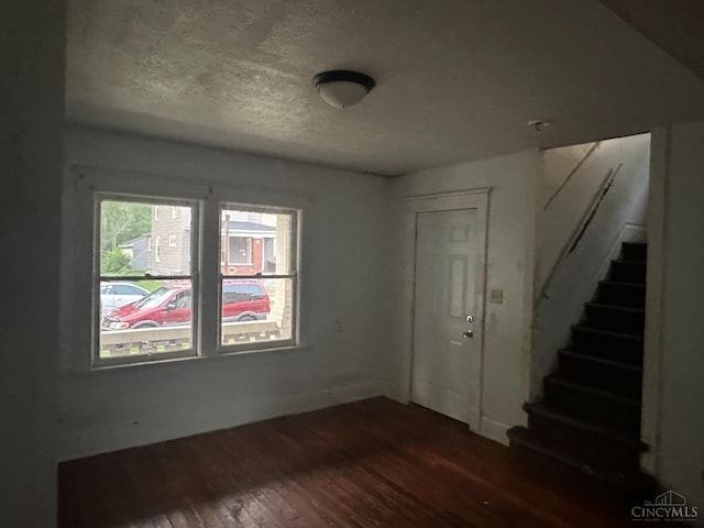 1812 Carroll Ave, Middletown, OH 45042 - foyer entrance featuring wood finished floors, stairway, and a textured ceiling