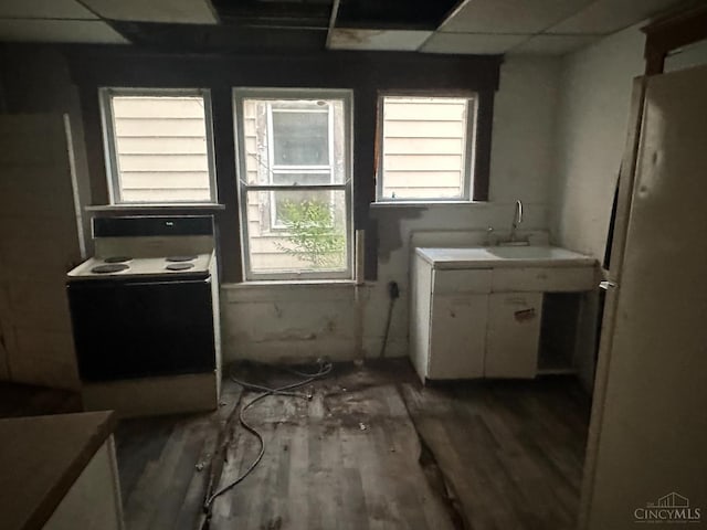 1812 Carroll Ave, Middletown, OH 45042 - kitchen featuring white range with electric stovetop, white cabinets, and wood finished floors