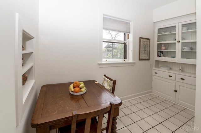 2851 Pine Grove Ave, Cincinnati, OH 45208 - dining space featuring light tile patterned floors and built in shelves