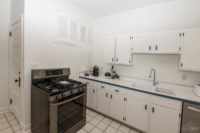 2851 Pine Grove Ave, Cincinnati, OH 45208 - kitchen with stainless steel appliances, light tile patterned flooring, white cabinets, and light countertops