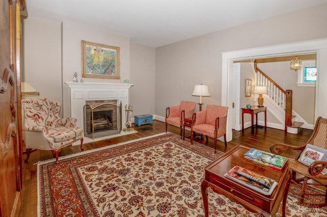 2851 Pine Grove Ave, Cincinnati, OH 45208 - living area with wood finished floors, stairs, and a fireplace
