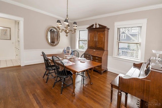 2851 Pine Grove Ave, Cincinnati, OH 45208 - dining area featuring a chandelier, dark wood-style flooring, and ornamental molding