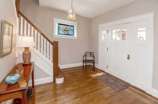 2851 Pine Grove Ave, Cincinnati, OH 45208 - foyer entrance with wood finished floors, stairway, and a chandelier