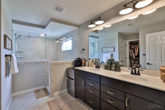 6352 Copperleaf Ln, Miami Twp, OH 45140 - bathroom with double vanity, walk in shower, a walk in closet, and tile patterned floors