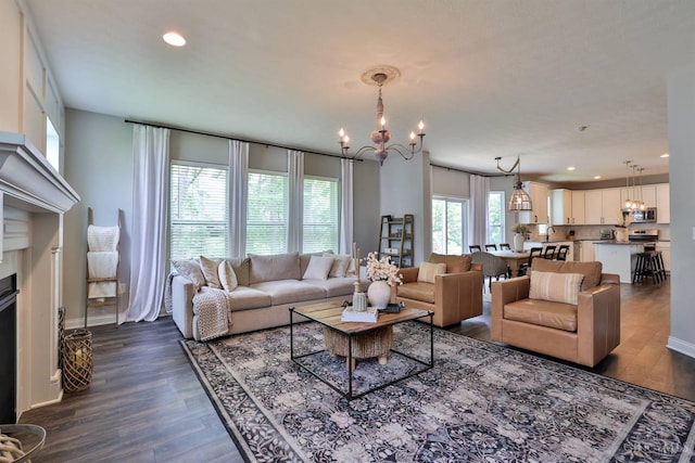 6352 Copperleaf Ln, Miami Twp, OH 45140 - living room featuring dark wood finished floors, a chandelier, recessed lighting, and a fireplace