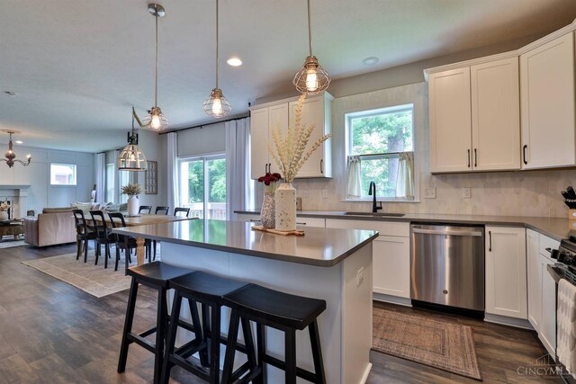 6352 Copperleaf Ln, Miami Twp, OH 45140 - kitchen with dishwasher, healthy amount of natural light, dark wood finished floors, and recessed lighting