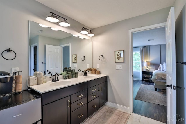 6352 Copperleaf Ln, Miami Twp, OH 45140 - ensuite bathroom with double vanity and baseboards