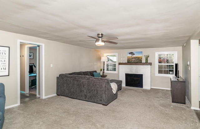 4 Brooklyn Ln, Miami Twp, OH 45150 - carpeted living room with a fireplace and ceiling fan