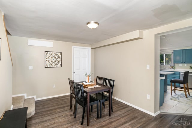 4 Brooklyn Ln, Miami Twp, OH 45150 - dining area featuring dark wood-type flooring and baseboards