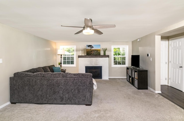 4 Brooklyn Ln, Miami Twp, OH 45150 - living room featuring a ceiling fan, carpet floors, and a brick fireplace
