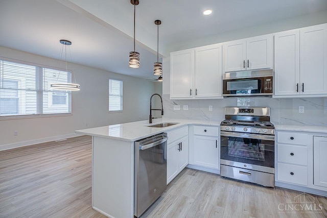 3104 Celeron Ave, Cincinnati, OH 45209 - kitchen featuring stainless steel appliances, tasteful backsplash, white cabinets, ceiling fan, and light wood finished floors