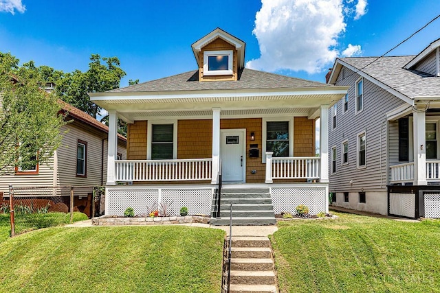3104 Celeron Ave, Cincinnati, OH 45209 - view of front of home with a shingled roof, covered porch, and a front lawn