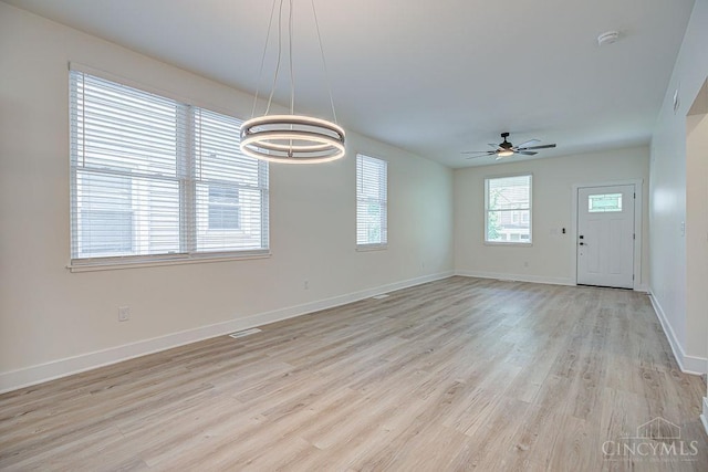 3104 Celeron Ave, Cincinnati, OH 45209 - empty room featuring ceiling fan, light wood-type flooring, a chandelier, and a smoke detector