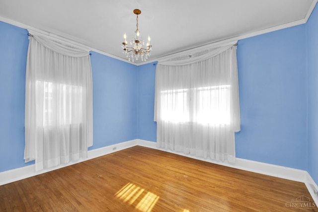 3459 Alta Vista Ave, Cheviot, OH 45211 - spare room featuring a chandelier, wood finished floors, and crown molding