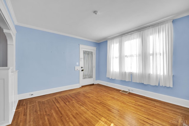 3459 Alta Vista Ave, Cheviot, OH 45211 - unfurnished room featuring plenty of natural light, wood finished floors, crown molding, and a smoke detector