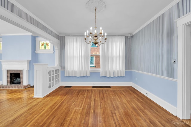 3459 Alta Vista Ave, Cheviot, OH 45211 - unfurnished dining area featuring wood finished floors, a chandelier, crown molding, and a fireplace