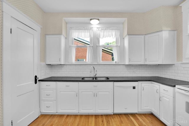 3459 Alta Vista Ave, Cheviot, OH 45211 - kitchen featuring white appliances, dark countertops, wallpapered walls, and white cabinetry