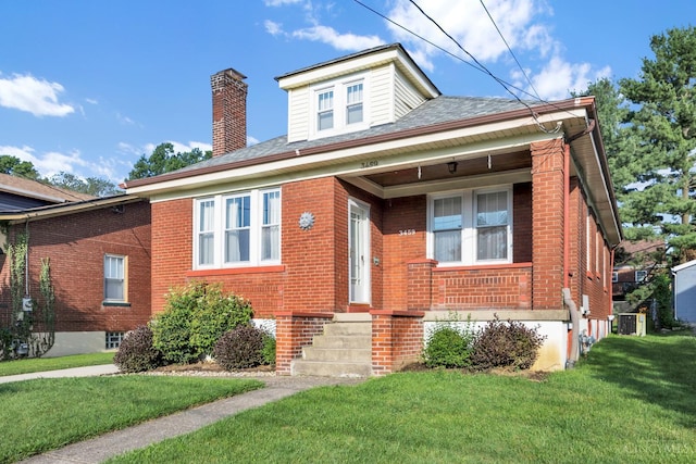 3459 Alta Vista Ave, Cheviot, OH 45211 - bungalow featuring brick siding, a front yard, and a chimney