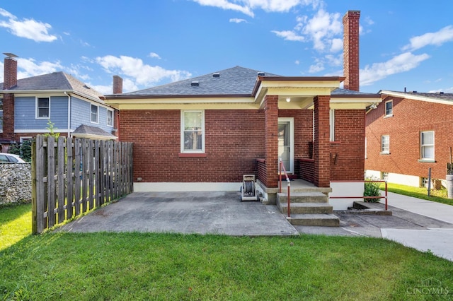 3459 Alta Vista Ave, Cheviot, OH 45211 - back of house with brick siding, a chimney, and a patio