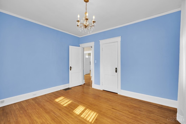 3459 Alta Vista Ave, Cheviot, OH 45211 - empty room with a chandelier, light wood-style flooring, and ornamental molding