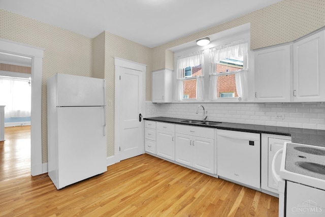 3459 Alta Vista Ave, Cheviot, OH 45211 - kitchen with white appliances, light wood-style flooring, wallpapered walls, white cabinetry, and dark countertops