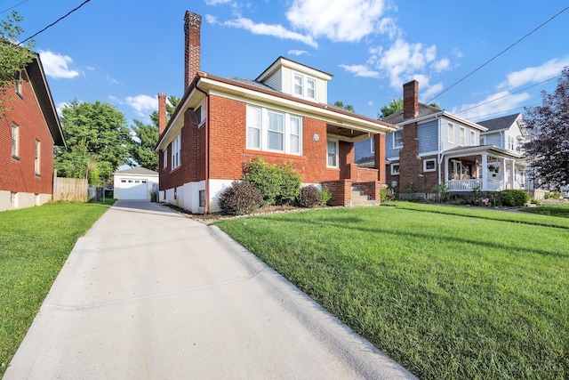 3459 Alta Vista Ave, Cheviot, OH 45211 - view of front facade with a chimney, brick siding, a front yard, an outbuilding, and concrete driveway
