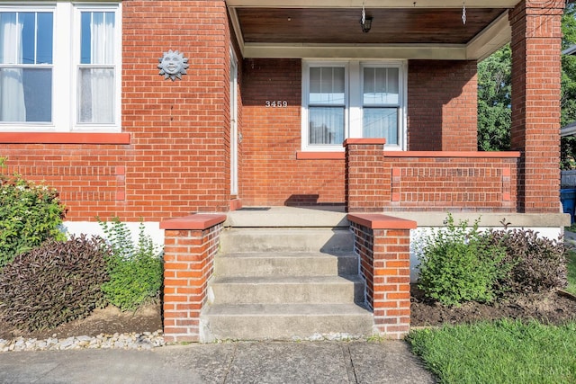 3459 Alta Vista Ave, Cheviot, OH 45211 - view of exterior entry featuring covered porch and brick siding
