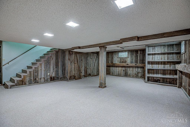 2974 Acer Ct, Ross Twp, OH 45013 - basement with a textured ceiling, stairway, wooden walls, and carpet floors