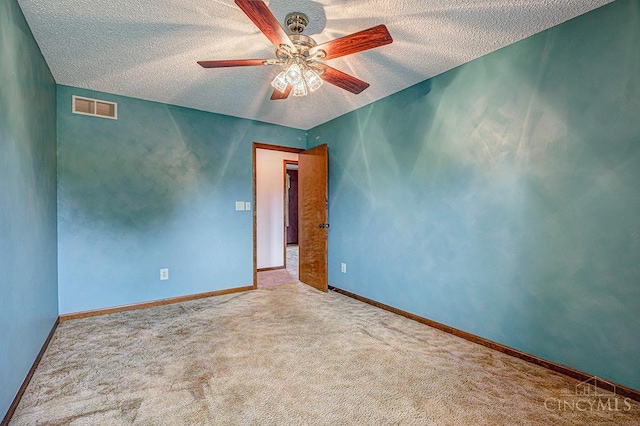 2974 Acer Ct, Ross Twp, OH 45013 - carpeted empty room with a textured ceiling and a ceiling fan
