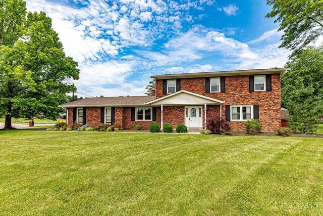 2974 Acer Ct, Ross Twp, OH 45013 - traditional home featuring a front lawn and brick siding