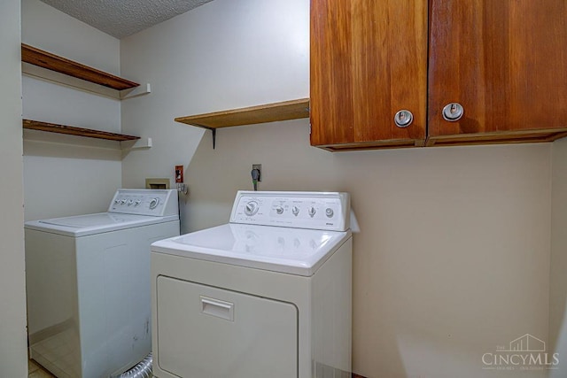 2974 Acer Ct, Ross Twp, OH 45013 - laundry area with independent washer and dryer, cabinet space, and a textured ceiling