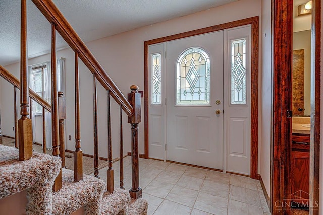 2974 Acer Ct, Ross Twp, OH 45013 - entrance foyer featuring stairs, light tile patterned flooring, and a textured ceiling