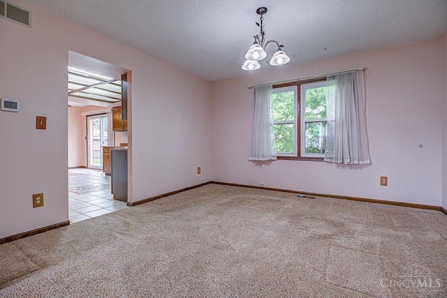 2974 Acer Ct, Ross Twp, OH 45013 - spare room featuring light colored carpet, a chandelier, a textured ceiling, and light tile patterned floors