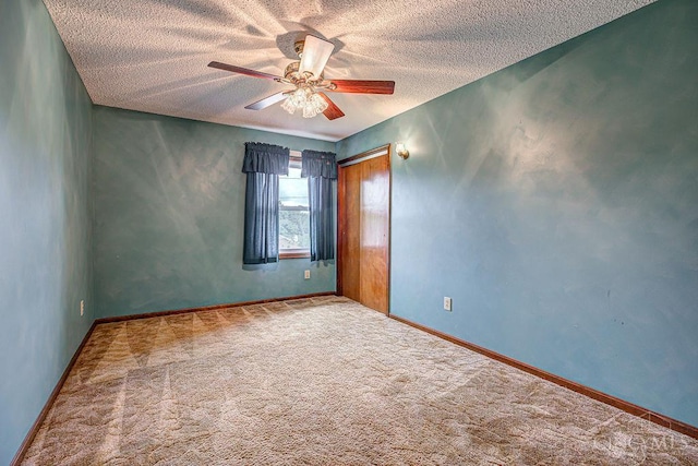 2974 Acer Ct, Ross Twp, OH 45013 - unfurnished room with a textured ceiling, a ceiling fan, and carpet