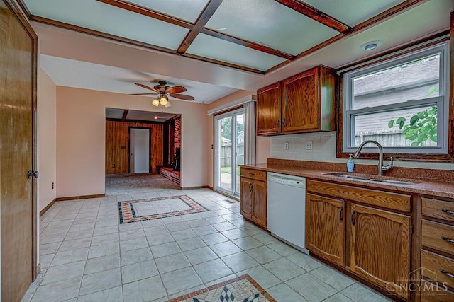 2974 Acer Ct, Ross Twp, OH 45013 - kitchen with dishwasher, dark countertops, light tile patterned flooring, ceiling fan, and brown cabinetry