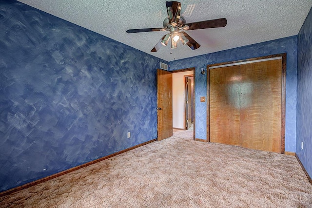 2974 Acer Ct, Ross Twp, OH 45013 - unfurnished bedroom with carpet, a textured ceiling, ceiling fan, and a closet