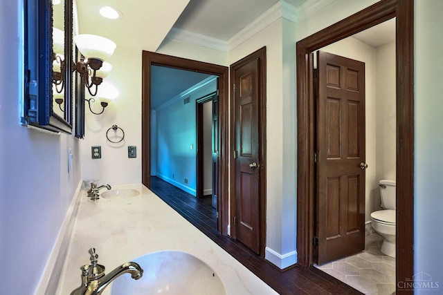 254 Compton Rd, Wyoming, OH 45215 - bathroom with wood finished floors, crown molding, and double vanity