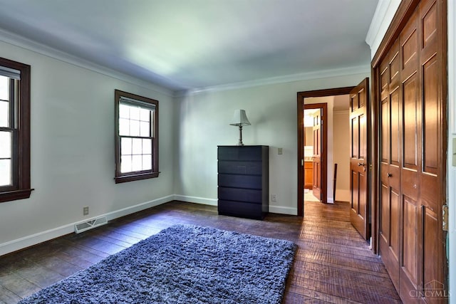 254 Compton Rd, Wyoming, OH 45215 - unfurnished bedroom with dark wood-style flooring and crown molding