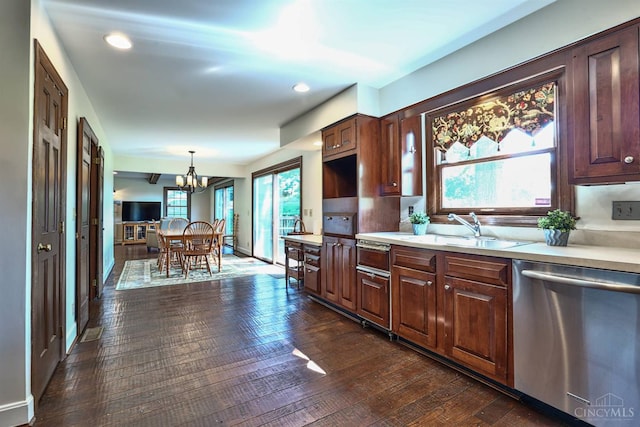 254 Compton Rd, Wyoming, OH 45215 - kitchen featuring dishwasher, light countertops, a chandelier, dark wood-style floors, and pendant lighting