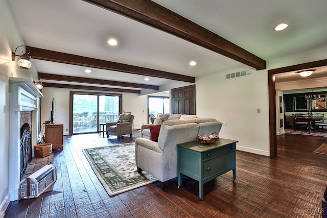 254 Compton Rd, Wyoming, OH 45215 - living area featuring dark wood-type flooring, recessed lighting, beam ceiling, and a fireplace