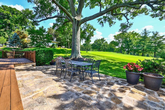 254 Compton Rd, Wyoming, OH 45215 - view of patio / terrace featuring a wooden deck, outdoor dining area, view of scattered trees, and view of golf course