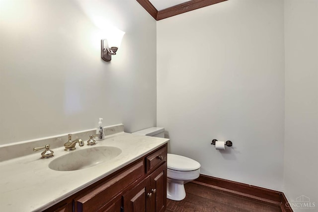 254 Compton Rd, Wyoming, OH 45215 - bathroom featuring vanity, wood finished floors, and crown molding
