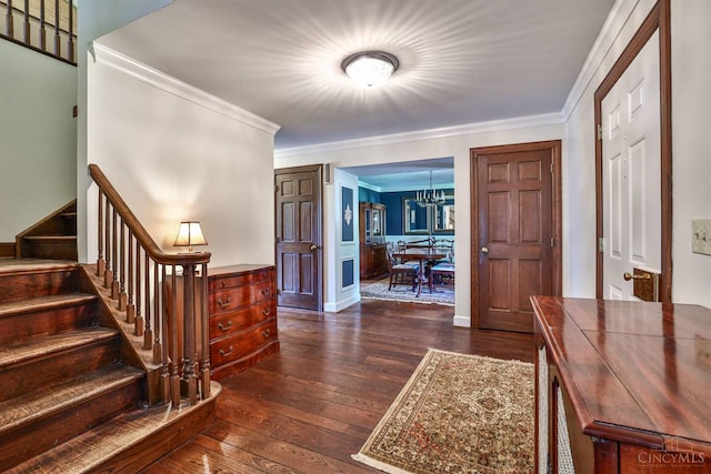 254 Compton Rd, Wyoming, OH 45215 - entrance foyer with stairs, ornamental molding, dark wood finished floors, and a chandelier