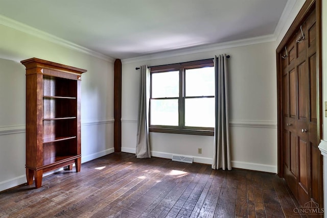 254 Compton Rd, Wyoming, OH 45215 - unfurnished bedroom featuring dark wood-type flooring and ornamental molding