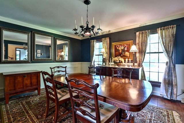 254 Compton Rd, Wyoming, OH 45215 - dining area featuring a chandelier, wainscoting, crown molding, plenty of natural light, and wood finished floors