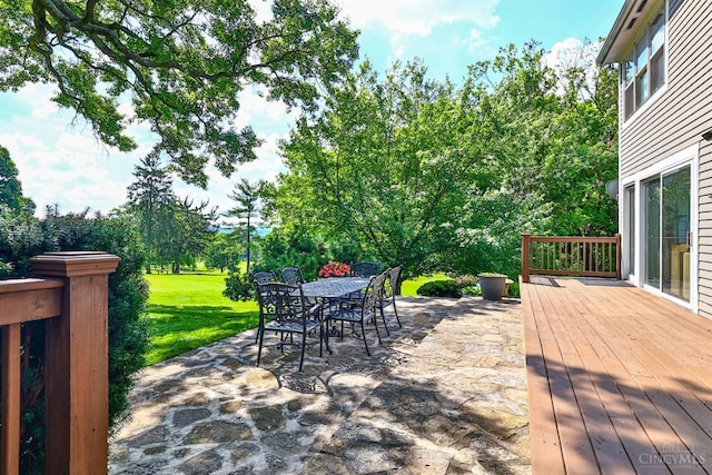 254 Compton Rd, Wyoming, OH 45215 - view of patio / terrace with outdoor dining area, a deck, and view of wooded area